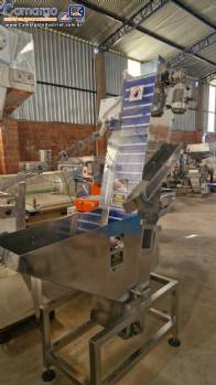 Alimentador posicionador abastecedor em a�o inox de tampas Norma